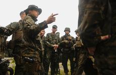 1st. Lt. Bridgett Soares, military police platoon commander with Combat Logistics Battalion 31, 31st Marine Expeditionary Unit, briefs U.S. Marines and their Philippine counterparts before improvised explosive device detection and convoy defense tactics training at Colonel Ernesto Ravina Air Base, Philippines, Oct. 7, 2016.