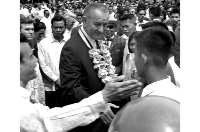 President Johnson mingles with the crowd during the Manila Summit.