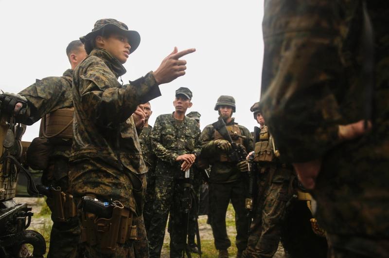 1st. Lt. Bridgett Soares, military police platoon commander with Combat Logistics Battalion 31, 31st Marine Expeditionary Unit, briefs U.S. Marines and their Philippine counterparts before improvised explosive device detection and convoy defense tactics training at Colonel Ernesto Ravina Air Base, Philippines, Oct. 7, 2016.