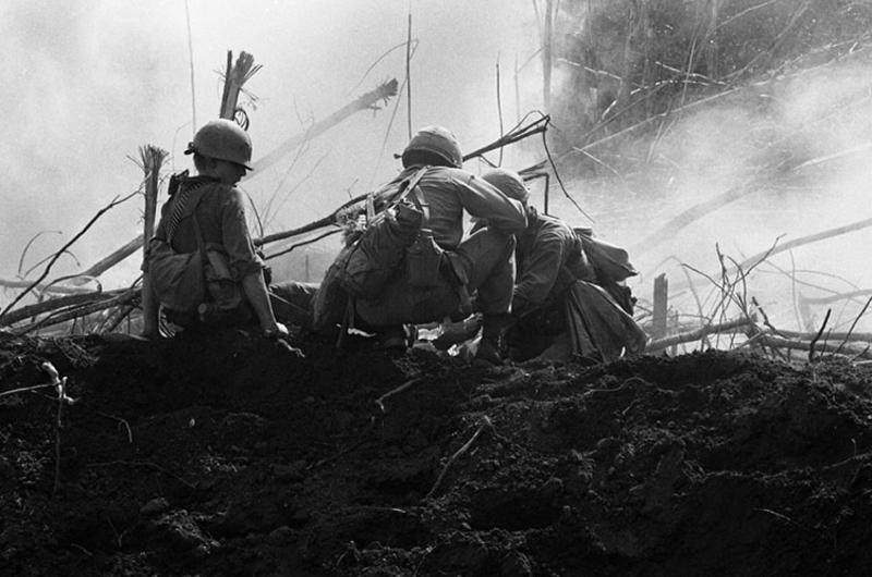 Infantrymen, of the 2nd Battalion, 35th Infantry bandage a wounded soldier after an American-fired mortar round fell short and exploded in the midst of the company.