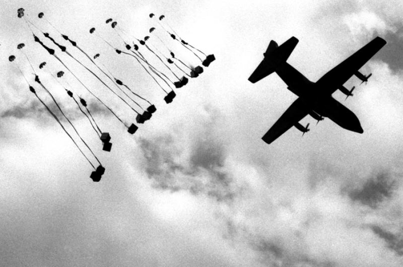 An Air Force C-130 Hercules drops supplies to U.S. troops attempting to encircle a suspected Viet Cong headquarters during Operation Junction City in Vietnam in February, 1967.
