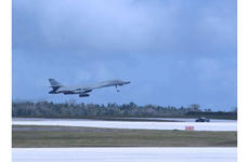A B-1B Lancer bomber takes off from the runway at Andersen Air Force Base, Guam.