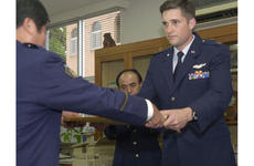 Capt. Thomas Geiser is commended by an Okinawa police station for saving an elderly man’s life April 3, 2003.