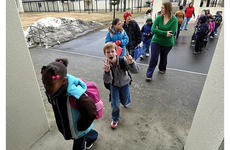 Staff and students return to Sollars Elementary School on Monday at Misawa Air Base, Japan.