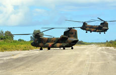 Japan Self-Defense Forces helicopters land on a World War II-era runway on Tinian, in the Northern Marianas, Tuesday, Nov. 8, 2016. U.S. forces assisted the Japanese-led event as part of the bilateral Keen Sword exercise.