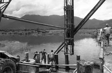 Seabees build a bridge on Route 1 between Phu Loc and Lang Co, South Vietnam, in 1967.