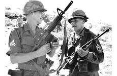 Sgt. Maj. Paul B. Huff, left, and Sgt. Maj. Walter T. Sabalauski meet in the field during an operation by the 1st Brigade, 101st Airborne Div., near Duc Pho, South Vietnam, in 1967.