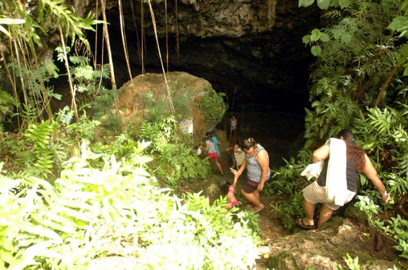 A group of Guam residents climb down to the freshwater caves in the Pagat area, where the island&#39;s native Chamorro residents found fresh water thousands of years ago.