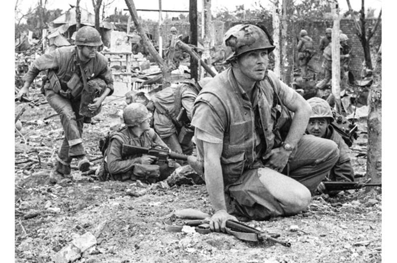 Marine Corps Staff Sgt. Bob Thoms assesses the situation before leading an assault on the Dong Ba Tower, considered a crucial objective for U.S. forces in the fierce battle for the city of Hue.