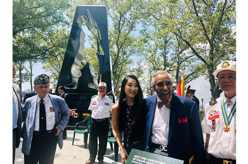 Hannah Kim with Korean War veteran and former congressman Charlie Rangel at the New York Korean War Veterans Memorial.