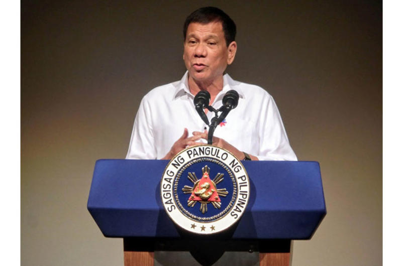 Philippine President Rodrigo Duterte speaks to the Philippine Economic Forum in Tokyo, Wednesday, Oct. 26, 2016. Duterte said he wants to end his nation's reliance on foreign military assistance.