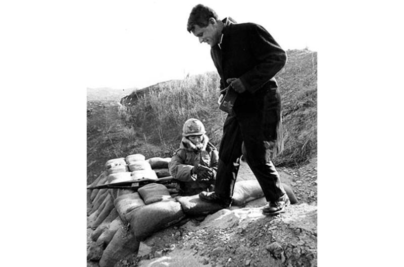 Atty. Gen. Robert Kennedy visits with a South Korean soldier near the DMZ in January, 1964.