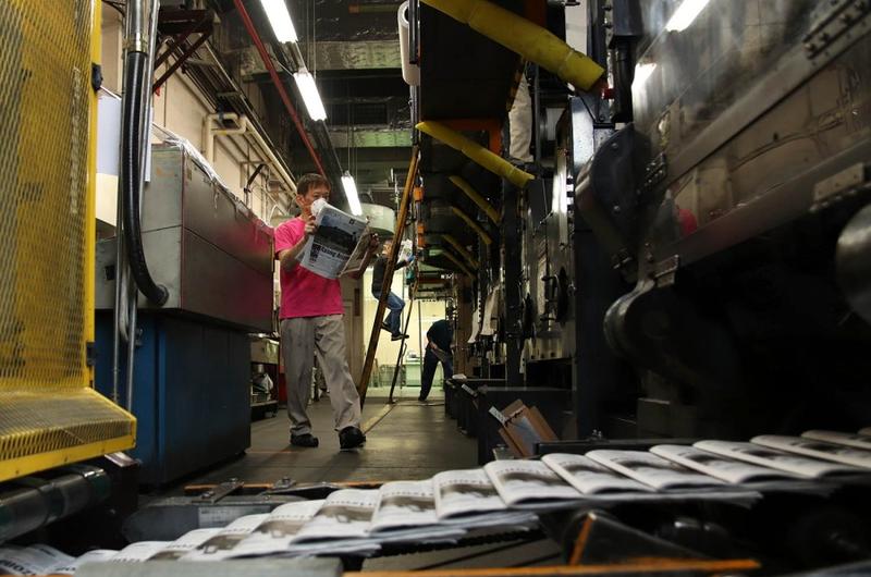 An issue of Stars and Stripes rolls off the press in central Tokyo.