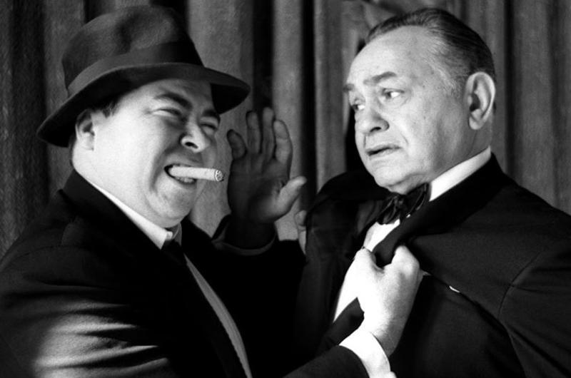 Movie tough guy Edward G. Robinson pretends to cower at the rough treatment being meted out by Stars and Stripes' legendary columnist, Al Ricketts.