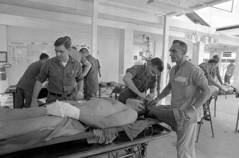 Hospital staff readies Life Magazine photographer Co Rentmeesteris for further transport after tending to his wounds at a U.S. Army hospital Rentmeester was brought to the hospital after being hit by a bullet while covering the fighting in Saigon May 6th near Tan Son Nhut. Rentmeester was hit in his left hand.