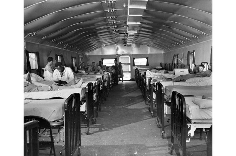 Patients at 121st evacuation hospital relax in one of many wards.