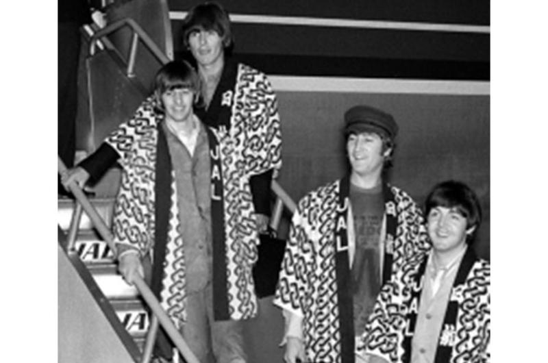George Harrison, Ringo Starr, John Lennon and Paul McCartney (from top) — arrive in Japan for five shows at the famed Nippon Budokan concert hall.