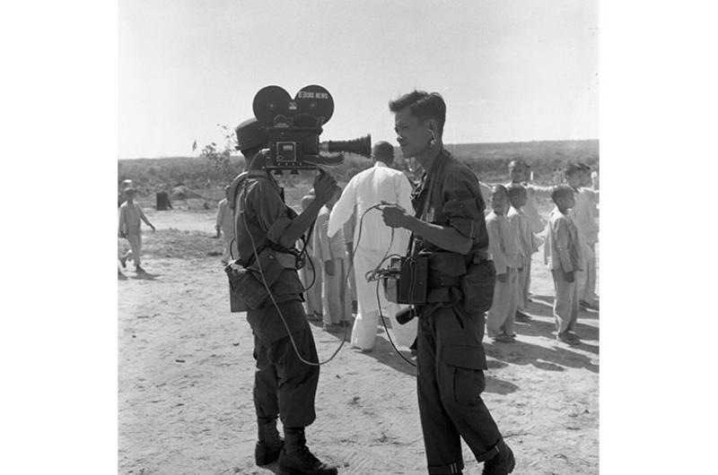 Unidentified CBS camera and sound man at a Buddhist orphanage, possibly in Long Thanh, near Saigon.