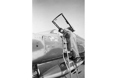 Capt. Nguyen Hung checks over his Vietnamese F5 "Falcon" prior to take-off on a strike mission.