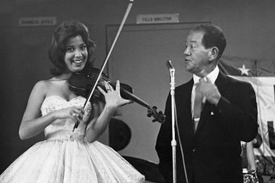 Star Player - Roberta Tennes plays a violin number during the "Laugh With the Girls" USO show at the 121st Evacuation Hospital at Ascom, Korea.